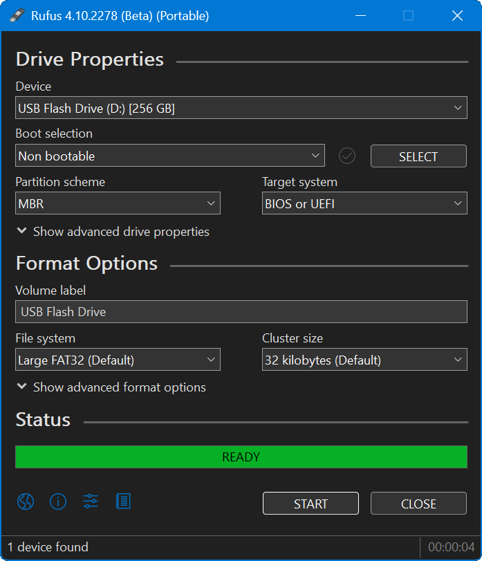 A Rufus window after formatting a USB flash drive. The Drive Properties section begins with a Device field which is filled with the selection USB Flash Drive (D:) [256 GB]. Beneath that, the Boot selection is Non bootable. Beneath that, the partition scheme is MBR, and the Target system is BIOS or UEFI. Beneath that is a Show advanced drive properties dropdown which is hidden. Beneath that is the Format Options section header. Beneath that is the Volume label, which is named USB Flash Drive. Beneath that, the File system selection is Large FAT32 (Default), and the Cluster size is 32 kilobytes (Default). Beneath that is a Show advanced format options dropdown which is hidden. Beneath that is a green status bar which says READY. Beneath that is a globe icon, an information icon, a slider bar icon, and a notebook icon. To the right of those icons are a Start button and a Close button. At the bottom, Rufus says 1 device found and shows a format time of 00:00:04.
